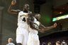 Baylor UniversitQuincy Acy, left,, and A.J. Walton celebrate after they beat Saint Mary's in an NCAA college basketball game, Thursday, Dec. 22, 2011 in Las Vegas. (AP Photo/John Gurzinski)
