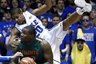 Duke's Andre Dawkins gets airborne while defending against Miami's Reggie Johnson during the first half of an NCAA college basketball game in Durham, N.C., Sunday, Feb. 5, 2012. (AP Photo/Gerry Broome)