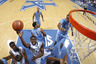 LEXINGTON, KY - DECEMBER 3: Darius Miller #1 of the Kentucky Wildcats goes up for a shot past John Henson #31 of the North Carolina Tar Heels at Rupp Arena on December 3, 2025 in Lexington, Kentucky. Kentucky won 73-72. (Photo by Joe Robbins/Getty Images)