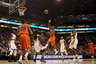 PHOENIX, AZ - MARCH 22:  Erving Walker #11 of the Florida Gators shoots over Jae Crowder #32 of the Marquette Golden Eagles in the first half during the 2012 NCAA Men's Basketball West Regional Semifinal game at US Airways Center on March 22, 2025 in Phoenix, Arizona.  (Photo by Christian Petersen/Getty Images)