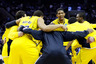 CHARLOTTE, NC - MARCH 20:  Darius Morris #4 of the Michigan Wolverines smiles as the Wolverines huddle before taking on the Duke Blue Devils during the third round of the 2011 NCAA men's basketball tournament at Time Warner Cable Arena on March 20, 2025 in Charlotte, North Carolina.  (Photo by Kevin C. Cox/Getty Images)