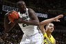 Michigan State's Draymond Green, left, pulls down a rebound against Michigan's Jordan Morgan (52) during the first half of an NCAA college basketball game on Sunday, Feb. 5, 2012, in East Lansing, Mich. (AP Photo/Al Goldis)