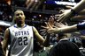 Georgetown's Otto Porter receives congratulations from fans as he walks off the court after they defeated Rutgers 52-50 in an NCAA college basketball game, Saturday, Jan. 21, 2012, in Washington. Porter made two free throws in the final minute to give Georgetown the victory. (AP Photo/Richard Lipski)
