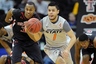 Mar 7, 2012; Kansas City, MO, USA; Oklahoma State Cowboys guard Cezar Guerrero (1) heads up court against the Texas Tech Red Raiders during the second half of the first round of the Big 12 Tournament at the Sprint Center. Oklahoma State defeated Texas Tech 76-60. Mandatory Credit: Peter G. Aiken-US PRESSWIRE
